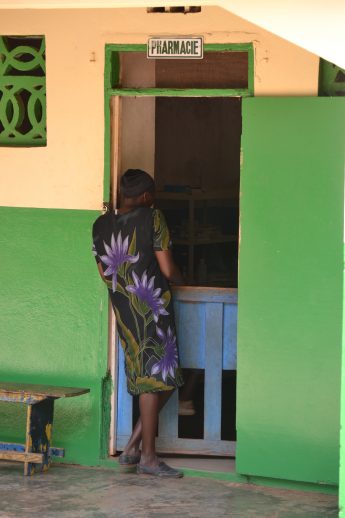 Chantal, an HIV-­positive woman, waits for her monthly supply of antiretroviral medication at the Hôpital Immaculée Conception in Haiti. / Jean Jacques Augustin, SCMS