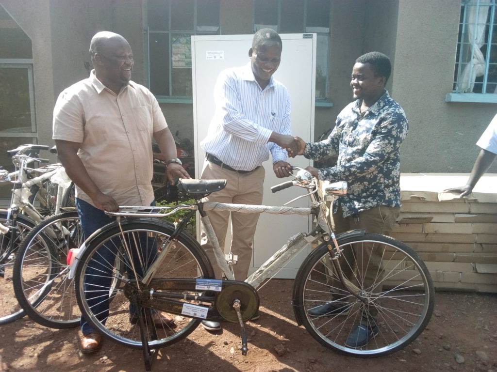 Community case workers supported by JSI's CHSSP receive bicycles to help them reach communities with health services.