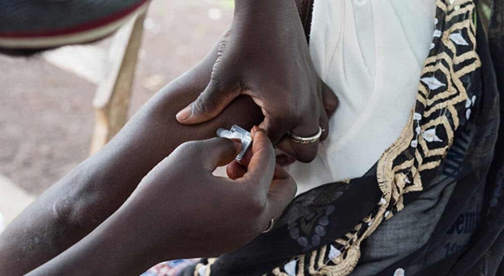 A person gets an injection of a birth control.